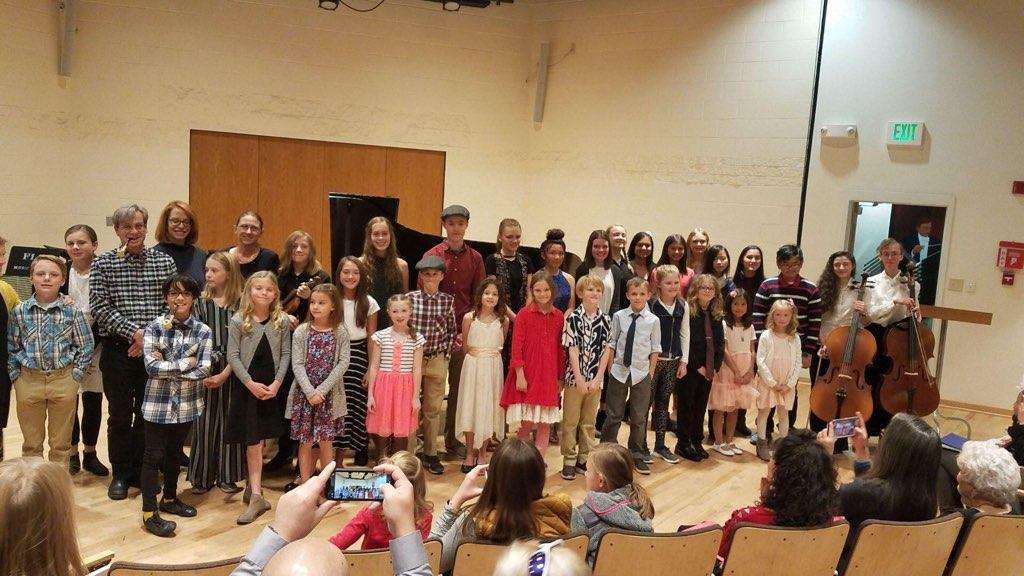 Picture kids bowing at Young Artist Festival